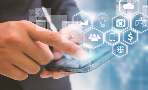 businessman using his phone to create a social media marketing plan