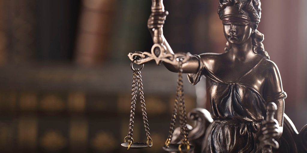 an attorney statue that represents how a small law firm marketing strategy has benefitted the attorney and his firm