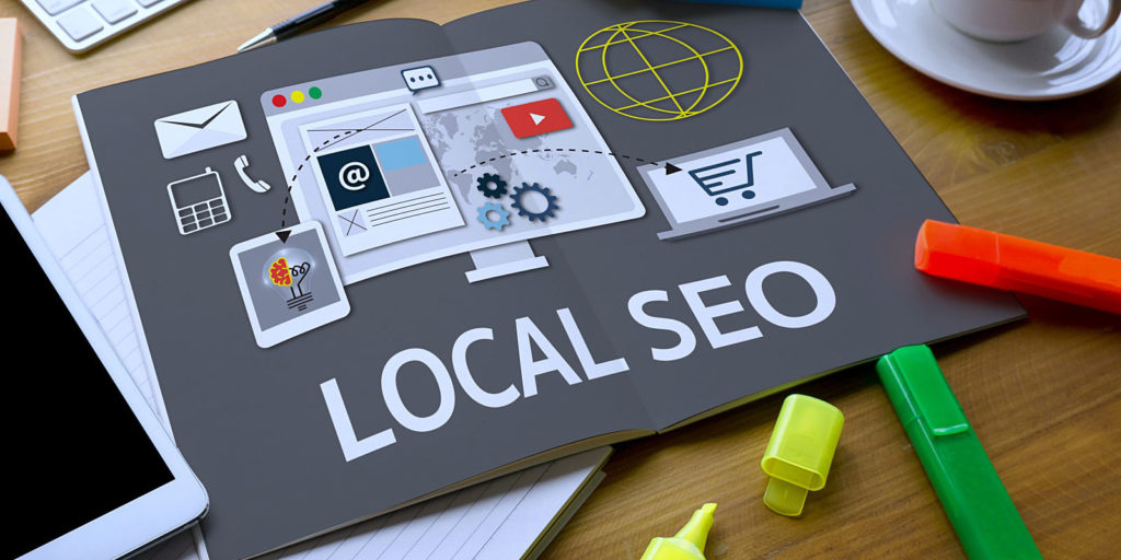 a gray book that shows an infographic about local SEO which is crucial for any insurance digital marketing strategy