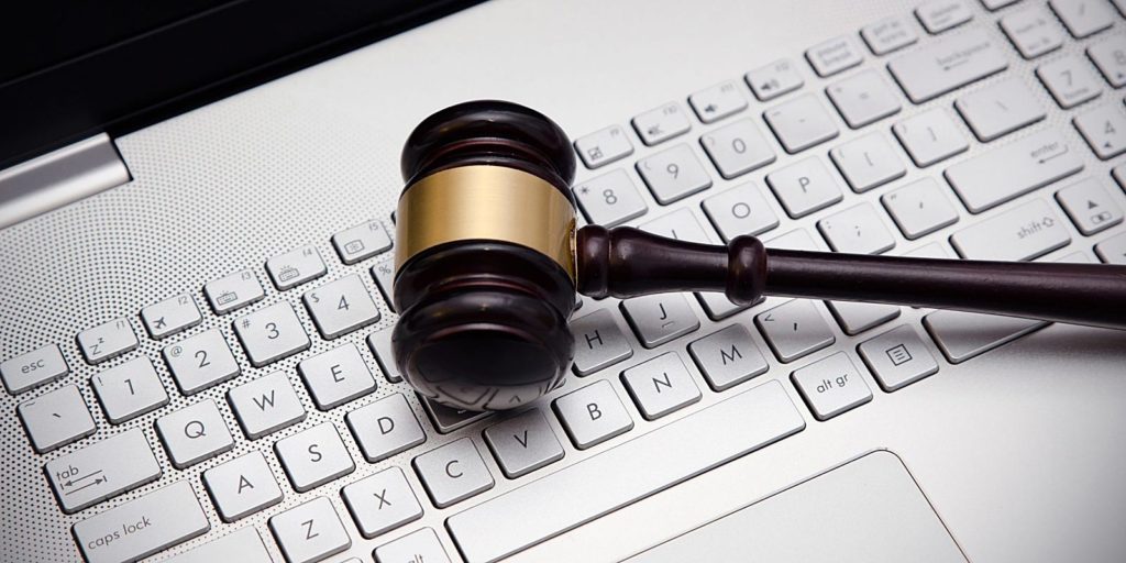 a gavel resting on top of a computer representing content marketing for law firms