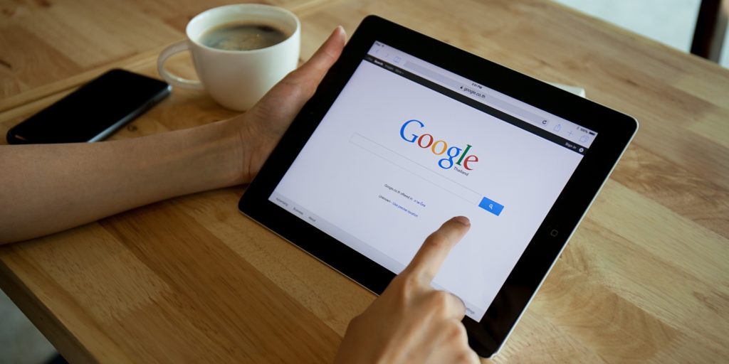 an individual using google to research seo vs sem