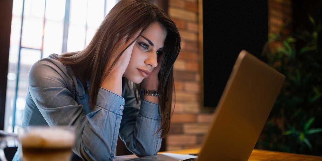 woman frustrated by a free website builder