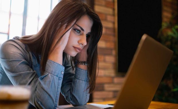 woman frustrated by a free website builder