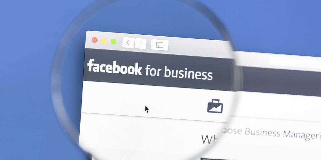 Magnifying glass looking at the Facebook for Businesses page