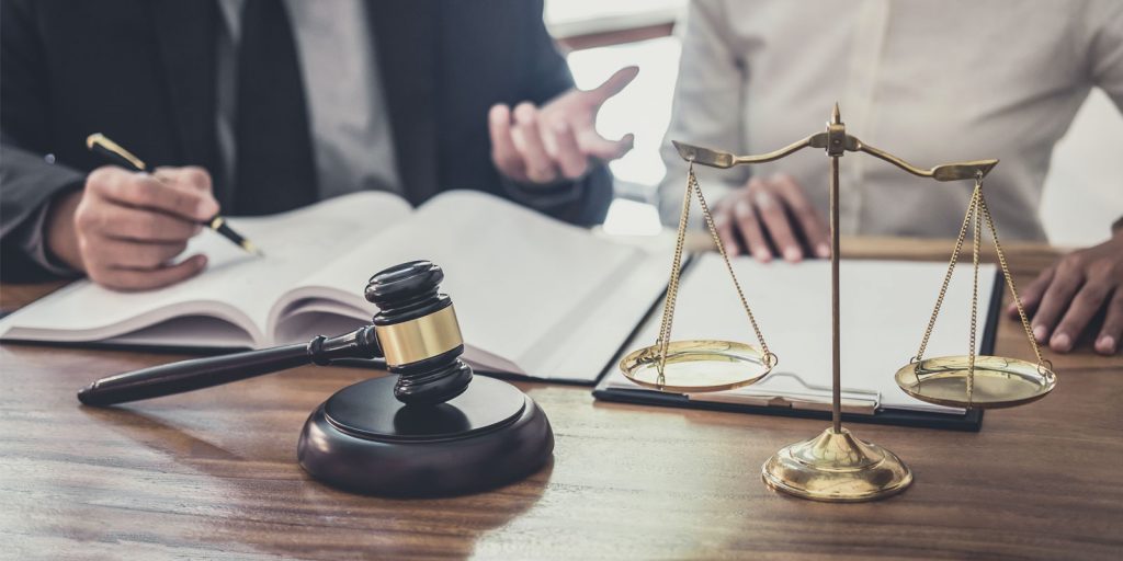 an attorney speaking with a new client after receiving digital marketing for law firms