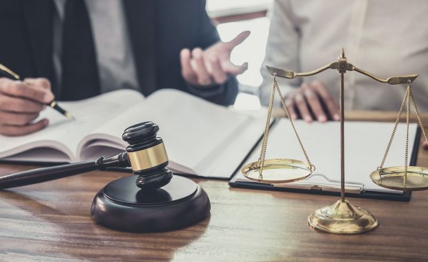 an attorney speaking with a new client after receiving digital marketing for law firms