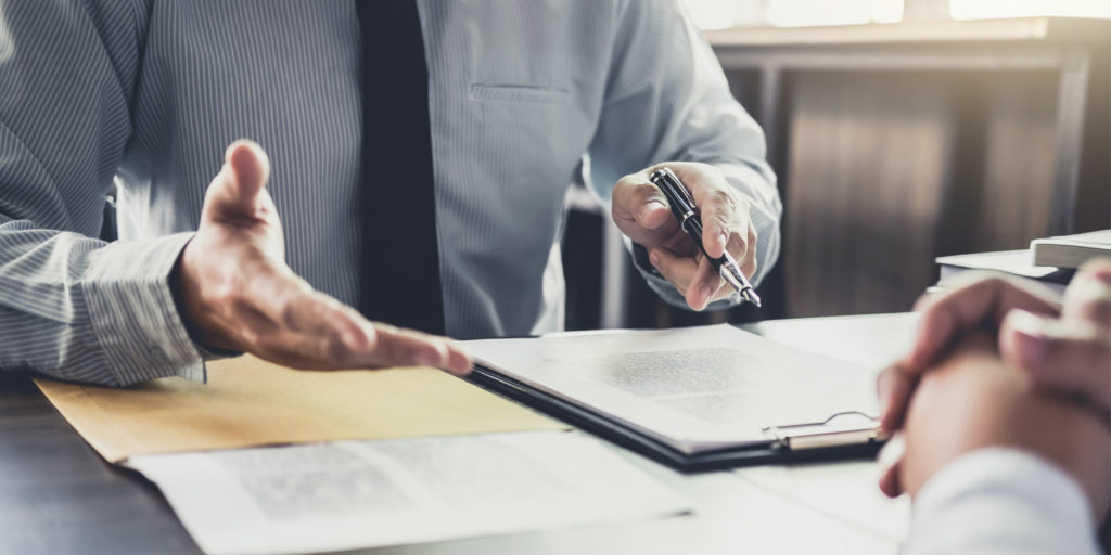 a business law attorney speaking with the owner of a law firm marketing agency