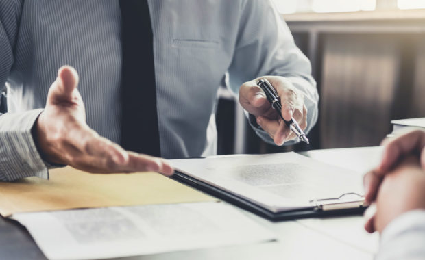 a business law attorney speaking with the owner of a law firm marketing agency