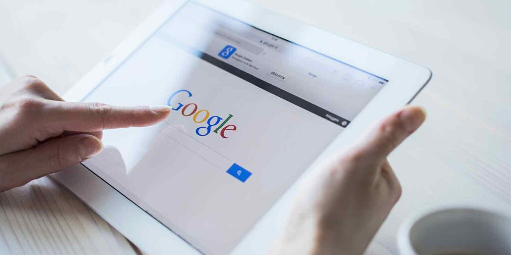 person using google on their tablet