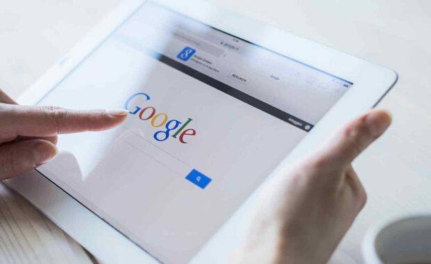 person using google on their tablet