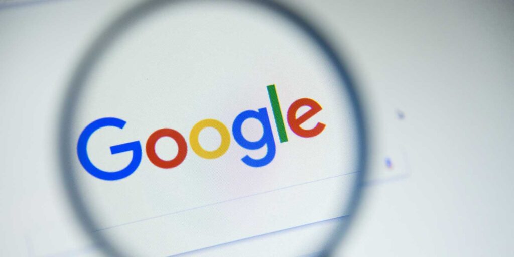 Magnifying glass hovering over Google's search ranking systems
