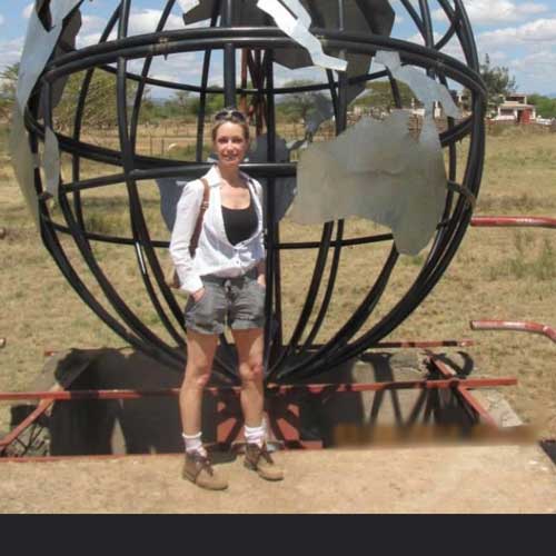 Michele next to globe