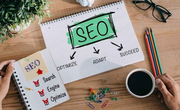 developer with SEO ideas in notebooks at workplace