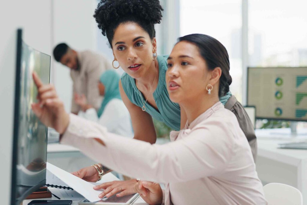 Digital marketing strategists reviewing stats