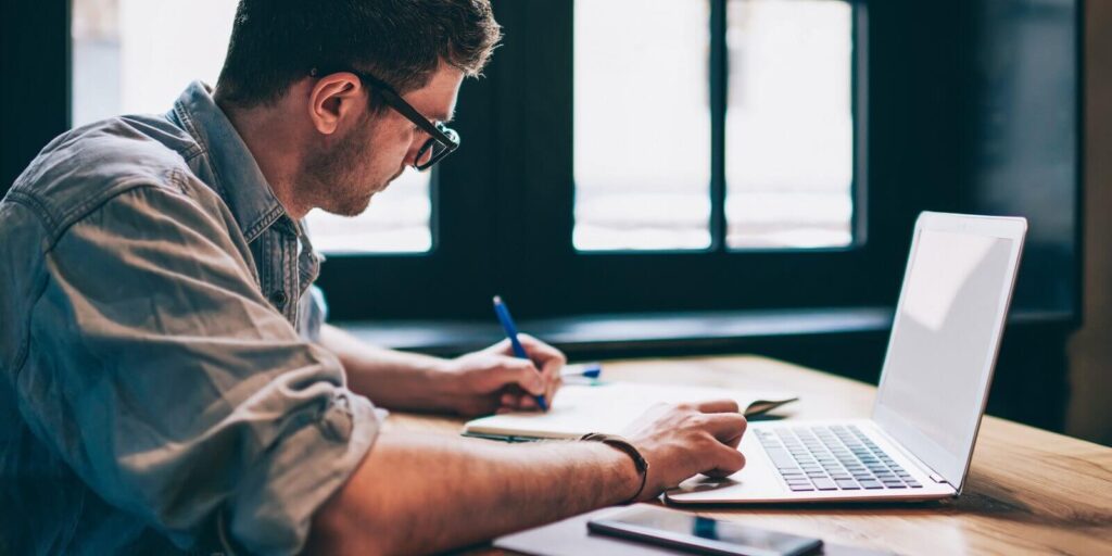 captive insurance agent searching information for on laptop