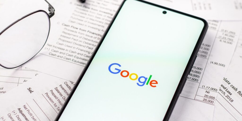 google logo on phone screen stock image