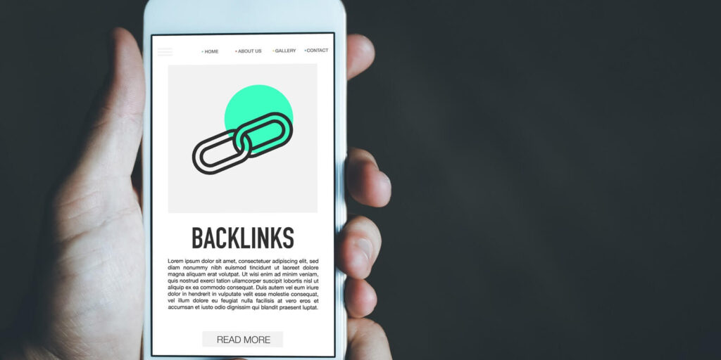 man reading about backlinks on mobile phone screen