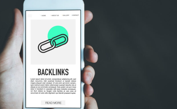 man reading about backlinks on mobile phone screen