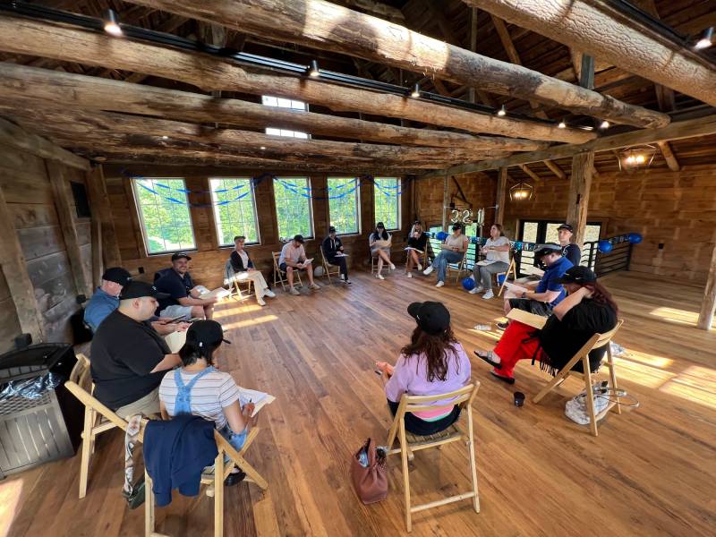 321 Team Members Sitting Around Discussing SEO Marketing Services